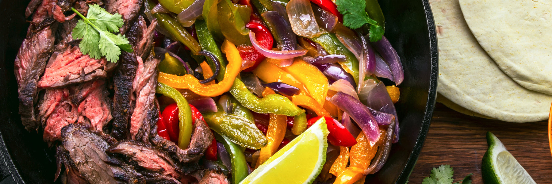 Skirt Steak with Red Peppers and Onions